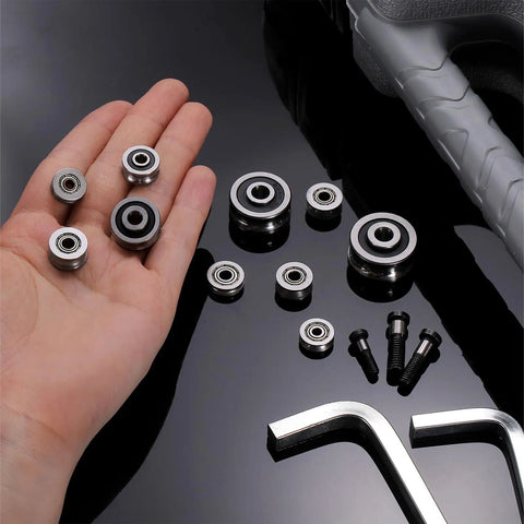 Hand holding Six Pack Small V Groove Pulleys 3x12x4mm Aluminum Alloy Miniature Pulleys for rail track linear motion system replacement