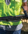 Worker holding Klein Tools Utility Staple Starter with Beefy Heavy Duty Staples For Ground Wire And Molding Installations 480 Pack