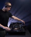 DJ using Four Deck All In One DJ System With A 10.1 Inch Touchscreen Built In Wi Fi SonicLink Wireless Tech Performance Pads And Beat FX