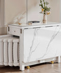 Modern white marble console table with folding stools stored underneath in a stylish living room setting, flowers on table.