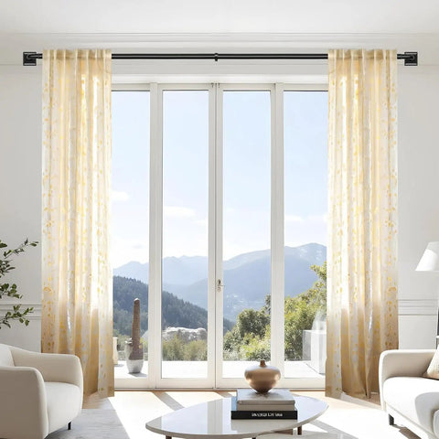 Room with Heavy Duty Blackout Curtain Rods For Windows 48 To 90 Inches With Wraparound Design, overlooking mountains.