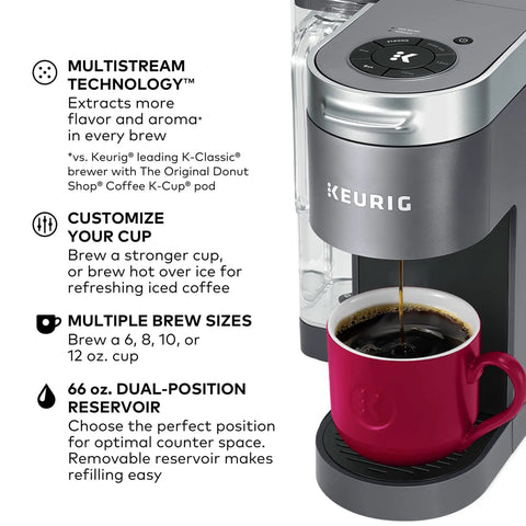 K Supreme Single Serve K Cup Pod Coffee Maker With MultiStream Technology Delivering Rich Flavor For Every Cup beside a red mug