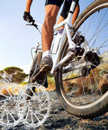 Cyclist on bike with 180mm Bike Disc Brake Rotors Set Of Two With 12 Screws For Most Road Mountain BMX Bikes in foreground
