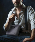 Man holding Odor Proof Stash Bag With Combination Lock, 11.8 x 8.6 inch, durable smell-proof gear storage with carbon lining.