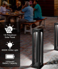 Outdoor Solar Floor Lanterns Set Of 2, Stainless Steel Black Lantern Lights illuminating patio at night