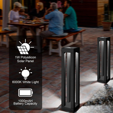 Outdoor Solar Floor Lanterns Set Of 2, Stainless Steel Black Lantern Lights illuminating patio at night