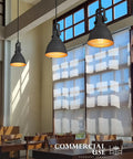 Sunrise Inspired Dope Two Tone Matte Black And Orange Gold Pendant Light For Kitchen Island Bar Or Entryway in a restaurant.