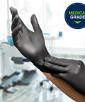 Built Tough Black Nitrile Exam Gloves 5.1 Mil Heavy Duty Powder Free Disposable shown during application in a medical setting.