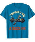 Funny Mechanic T Shirt For Men Grease Monkey And Wrench Turning Auto Repair Shop Humor Graphic Tee Soft Touch Cotton Crew Neck Apparel Daily Grind Real Deal Automotive Lover Sapphire Blue with a quirky wrench graphic.