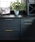 10 Pack Brushed Brass Cabinet Pulls With 7 Point Five Inch Hole Centers on dark kitchen drawers, stylish gold tone hardware.