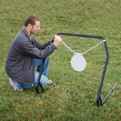 Man setting up Replacement Magnum Rifle Gong With AR550 Steel Construction for outdoor range shooting and hunting