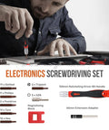 Man using screwdriver from 84 Piece Electronics Soldering Kit With Multimeter And Repair Tools For PCBs And Computers Including A 60W Soldering Iron And Blue ESD Mat Lightweight Starter Gear For DIY Nerds And Hobbyists.