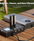 W63 FPV Drone Charger With Six Independent Ports and 1.54-inch IPS Display charging two batteries on a wooden table.