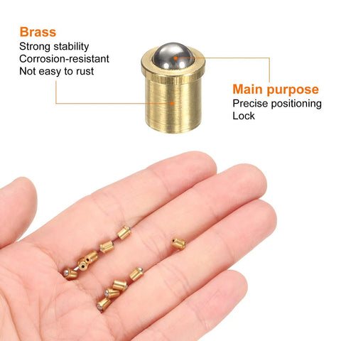 Top Shelf Brass Ball Spring Plungers Ten Pack Four By Five Millimeters with main plunger and smaller pieces in hand.