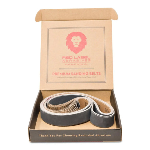 Open box showing 12-pack of 1 X 30 inch silicon carbide sanding belts for knife sharpening and metalworking.