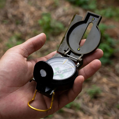 Holding Durable Wilderness Survival Compass for Orienteering And Outdoor Navigation with folding metal floating dial