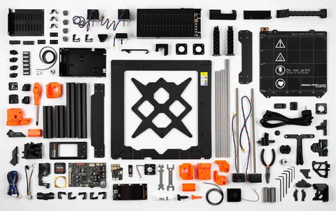 MK4S 3D Printer Kit components with automatic calibration and removable sheets, shown organized for a beginner-friendly DIY setup