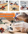 A technician using a Beefed Up Pro Grade Carbon Fiber Aluminum Propeller Balancer For RC Helicopters And Aircraft 250 450 500 600 700.