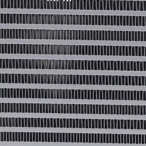 Close-up of industrial heat exchanger fins on a hydraulic oil cooler fan 60W 110V, built for high flow engineering machinery.