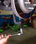 Premium Adjustable Ball Joint Separator And Puller Tool Knocks Stubborn Steering Joints Loose Up To Two Three Eight Inches For Cars Trucks Suv With Zero Headache No Sweat Garage Essential in use on vehicle suspension.