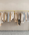 Industrial Wall Mounted Clothing Rack For Laundry And Retail 300cm with garments hanging in a small space