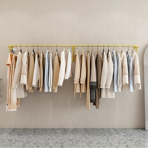 Industrial Wall Mounted Clothing Rack For Laundry And Retail 300cm with garments hanging in a small space