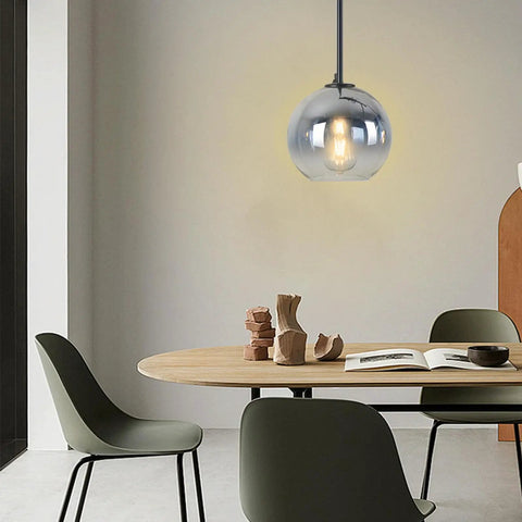 Dope Modern Black Globe Pendant Lights Two Pack, Glass Silver Gradient Orbs over dining table, soft warm glow