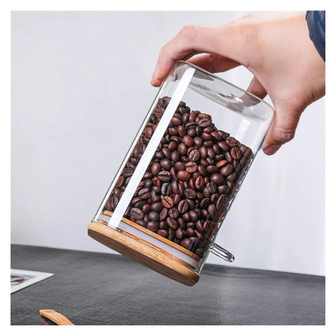 Hella Airtight Hand Blown Glass Coffee Canister With Spoon For Top Shelf Kitchen Organization showcasing coffee beans inside