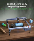 Falcon 10W Laser Engraver With Air Assist And Rotary Roller, engraving cylindrical tumbler, on a wooden table setup.