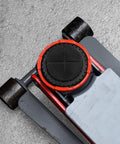 Universal floor jack rubber pad with red circular ring and black textured center on gray jack lift arm