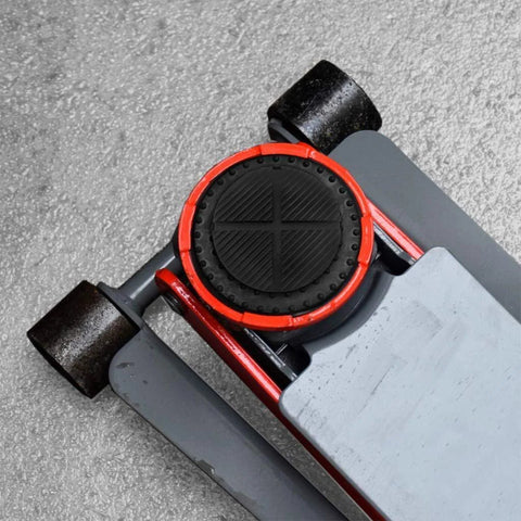 Universal floor jack rubber pad with red circular ring and black textured center on gray jack lift arm
