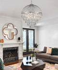 Nine Light Crystal Chandelier With K9 Crystals, Chrome Finish, Modern Luxe Vibe For Dining Room Or Living Room, 18 Inch Diameter, 19 Inch Height, Adjustable 39.4 Inch Chain, Perfect Foyer Or Kitchen Entry Light in a living room setting.