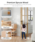Child painting a Double 30 By 80 Inch Bifold Barn Door With Tempered Frosted Glass And Solid Wood in a modern living room.