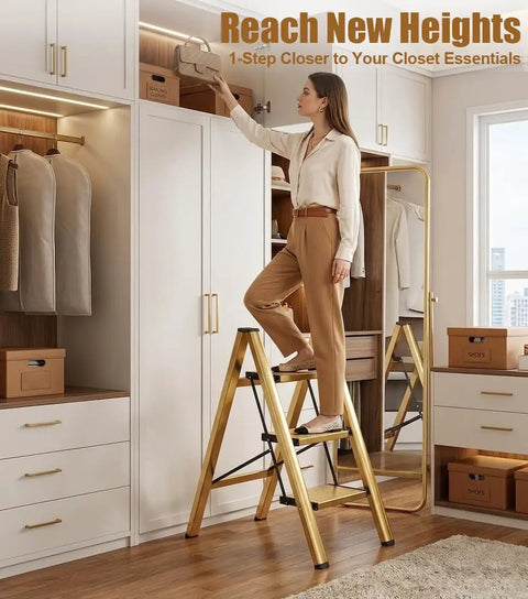Foldable 3 Step Stool Ladder In Gold Aluminum For Kitchen And Closet Ultra Lightweight With 330 Lb Capacity Anti Slip Wide Pedals Portable For Kids And Adults No Assembly Required Space Saving Design Folded Thickness 1.9 Inches, woman using it in a closet