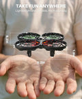 Person holding kid friendly indoor drone with obstacle avoidance and 20 minute flight time with two batteries, size labeled