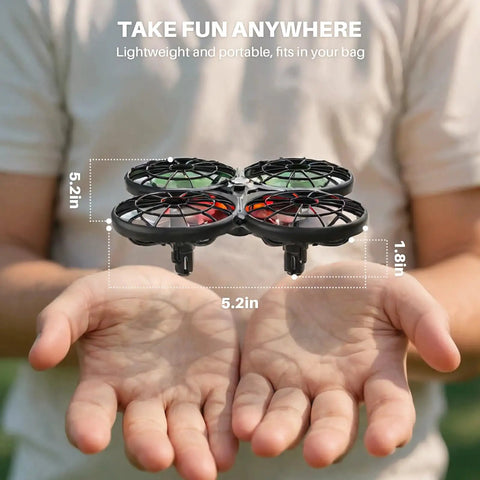 Person holding kid friendly indoor drone with obstacle avoidance and 20 minute flight time with two batteries, size labeled