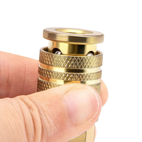 Two-pack 1/4 in NPT M-style brass quick-connect air hose fittings with knurled grips, held by fingers