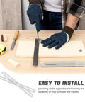 Installing stainless steel corner brackets with slideable screw slots on wooden furniture for reinforced support.