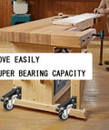 Heavy Duty Retractable Workbench Caster Wheel Set with smooth gliding polyurethane rollers on a wooden workbench.