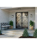 Two Light Outdoor Flush Mount Light In Antique Bronze With Clear Glass Diffuser on covered patio entrance.