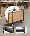 Beefy Heavy Duty Folding Table Cart With 1800 Lb Load Capacity in warehouse, steel frame, 5-inch casters, and securing straps visible.