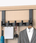 Over The Door Hooks 5 Pack Black T Hooks Coat Rack Organizer For Bathroom Towel Holder No Fuss Mount Fits Doors Up To One And Three Quarters Inches Thick Easy Install installed on a wooden door holding various items.