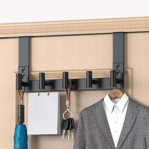 Over The Door Hooks 5 Pack Black T Hooks Coat Rack Organizer For Bathroom Towel Holder No Fuss Mount Fits Doors Up To One And Three Quarters Inches Thick Easy Install installed on a wooden door holding various items.