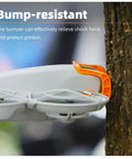 Quick-Release Gimbal Bumper For NEO Drone protecting gimbal during impact with tree, durable grey finish visible