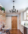 Industrial Candle Chandelier In Black Iron With Eight Lights, Dope Modern Farmhouse Hanging Pendant Light in a kitchen setting