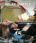 Couple relaxing in a tent with a closed Dual Zone Portable Fridge And Freezer With Heavy Duty Wheels, 42Quart Electric Cooler.