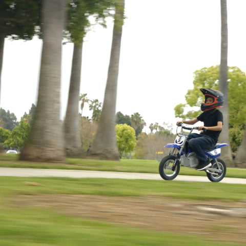 Child riding Kids Electric Dirt Bike For Ages 8 And Up with 24V Battery, Speeds Up To 14 MPH, 12 Inch Pneumatic Tires, Blue, outdoors