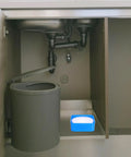 Top Shelf PTFE Adhesive Seal Tape 10 Rolls Of Water Leak Repair Wrap For Pipes And Threads Gonna Save Ya Time With This Ninja Tight DIY Plumbing Fix Daily under kitchen sink with pipes and trash can.