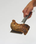 16-Inch Stainless Steel Tong And Turner Combo With Red Soft Grip Inserts flipping grilled chicken