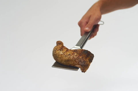 16-Inch Stainless Steel Tong And Turner Combo With Red Soft Grip Inserts flipping grilled chicken